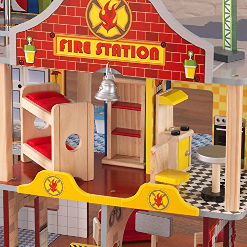 KidKraft- Deluxe Fire Rescue Estación de bomberos de juguete con kit de accesorios de 27 piezas y vehículos , Color Marrón (63214)