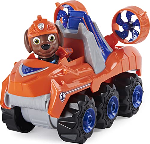 PAW Patrol, Dino Rescue Zuma'S Deluxe Rev Up vehículo con Misterio Dinosaurio Figura