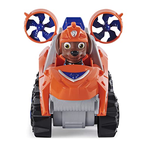 PAW Patrol, Dino Rescue Zuma'S Deluxe Rev Up vehículo con Misterio Dinosaurio Figura