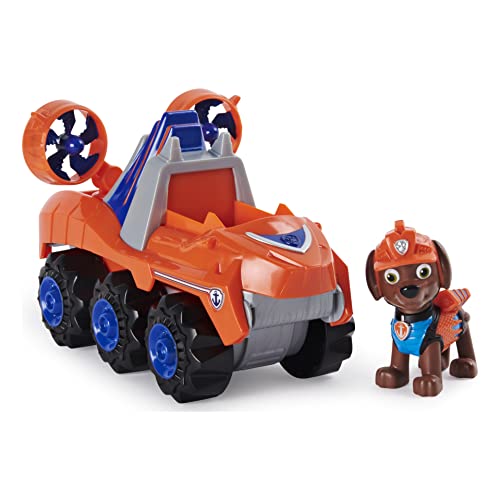 PAW Patrol, Dino Rescue Zuma'S Deluxe Rev Up vehículo con Misterio Dinosaurio Figura