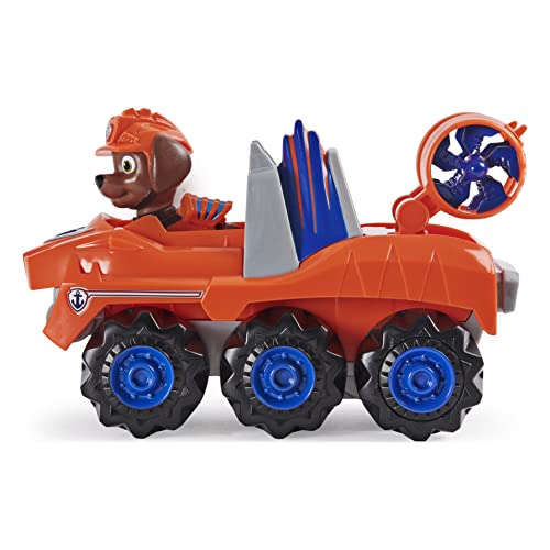 PAW Patrol, Dino Rescue Zuma'S Deluxe Rev Up vehículo con Misterio Dinosaurio Figura