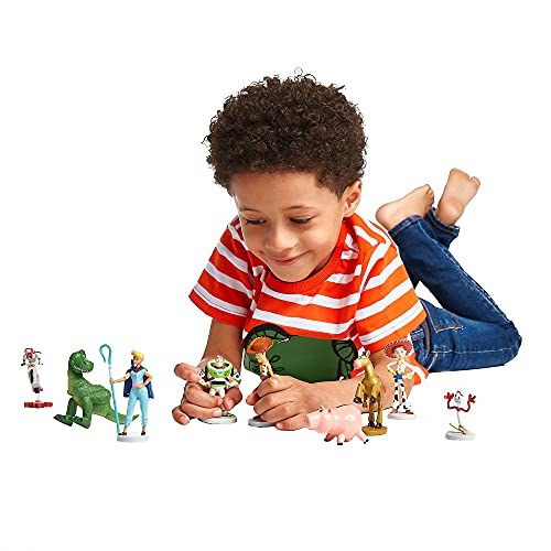 Disney Store Toy Story 4 Deluxe - Figura decorativa de 9 piezas, diseño Pixar Toy Story 4, contiene 9 figuras de plástico moldeadas para niños de 3 años