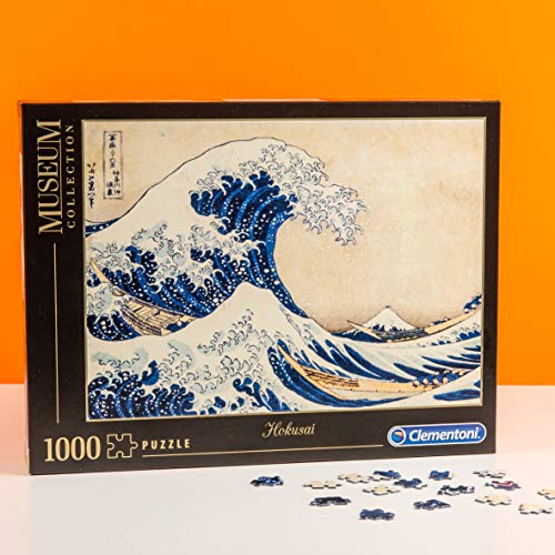 Clementoni- Museum Collection-Hokusai: La Grande Onda Los Pingüinos De Madagascar Puzzle, 1000 Piezas, Multicolor (39378)