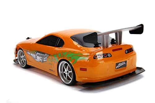 Jada Toys Fast & Furious RC Auto Drift 1995 Toyota Supra Turbo-Coche teledirigido con 2 Canales, función de Carga USB, 4 neumáticos de Repuesto, Incluye Pilas, 1:10, Color Naranja (253209003)