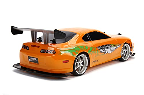 Jada Toys Fast & Furious RC Auto Drift 1995 Toyota Supra Turbo-Coche teledirigido con 2 Canales, función de Carga USB, 4 neumáticos de Repuesto, Incluye Pilas, 1:10, Color Naranja (253209003)