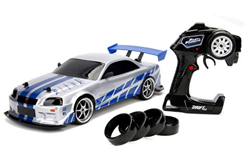 Jada Toys Fast & Furious RC Nissan Skyline GTR R34 - Coche teledirigido con Mando a Distancia, tracción a Las 4 Ruedas, función de Carga USB, Escala 1:10, Color Azul y Plateado