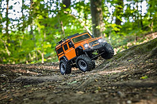 Carson 500404171 Land Rover Defender 1:8 - Coche Todoterreno teledirigido hasta 20 km/h rápido, 100% RTR, Incluye Pilas y batería con iluminación LED, Color Naranja