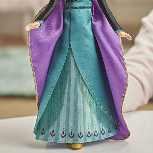 Disney Frozen 2 – Muñeca Princesa Disney Anna Cantante (francés) con Traje de Reina, 27 cm